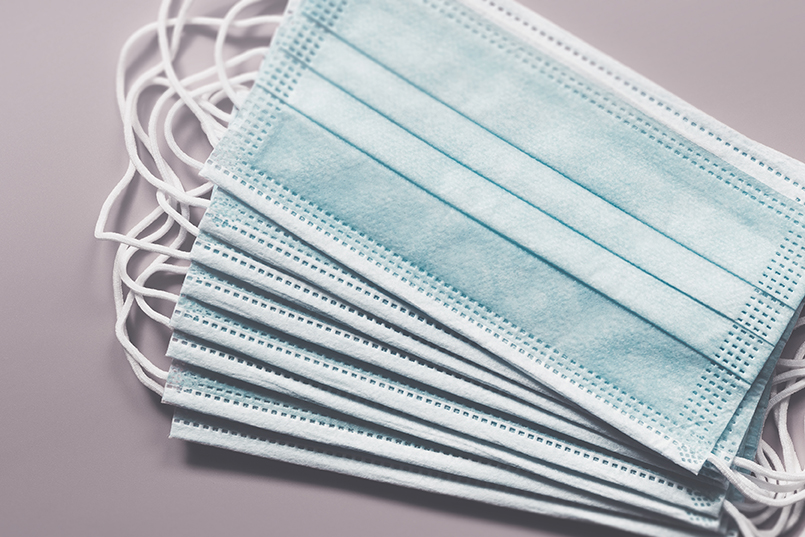Protective medical face masks. Personal protective equipment sho Protective medical face masks. Personal protective equipment sho